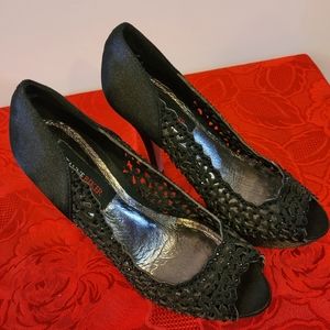 Black with Sparlkes heels. Size 6